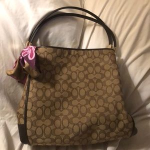 Coach brown triple section purse.